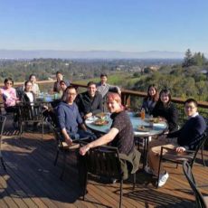 group at dining tables with panoramic valley view